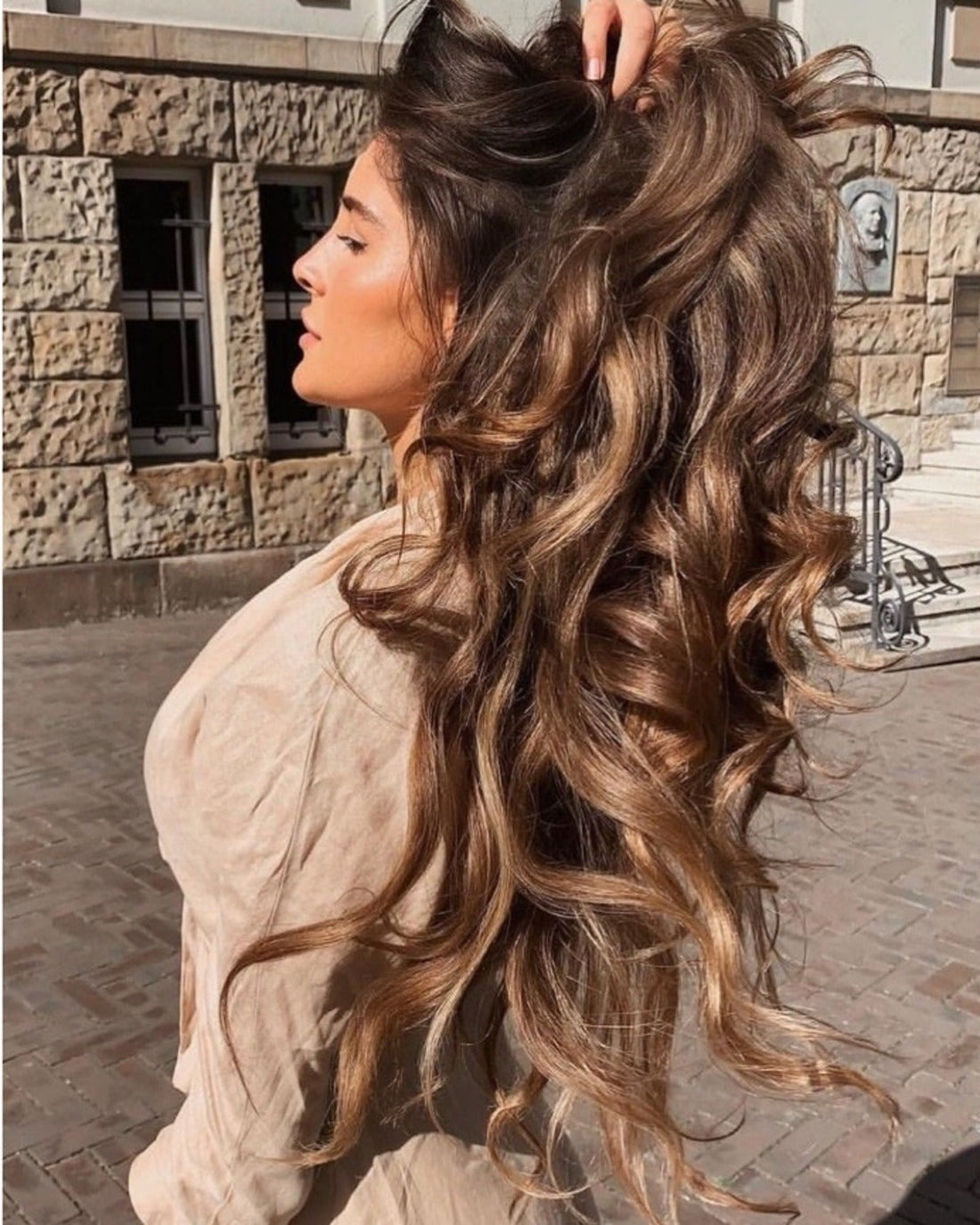 Healthy-looking shiny wavy hair in sunlight