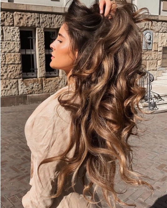 Healthy-looking shiny wavy hair in sunlight